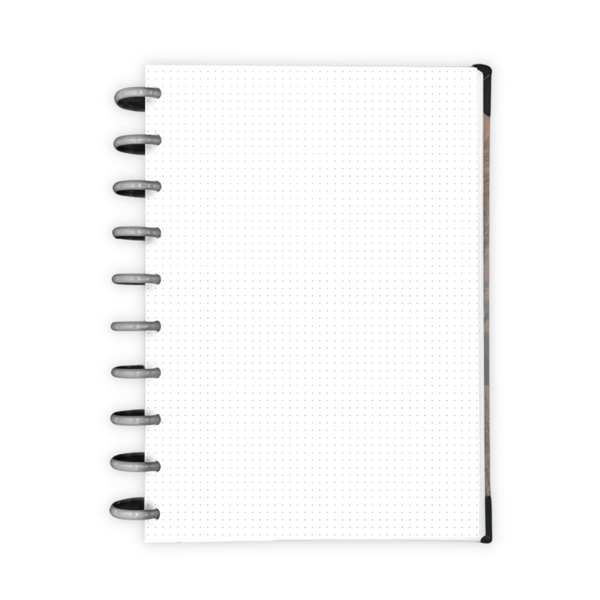 White dot grid paper inside a disc-bound planner