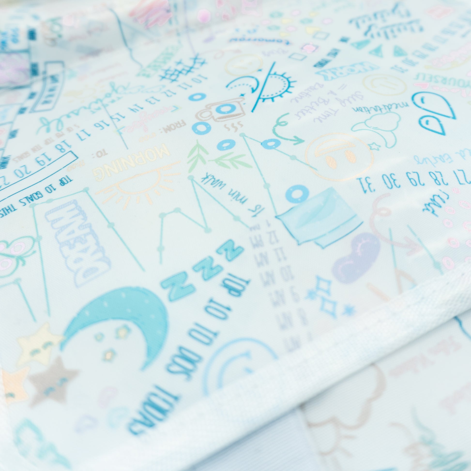 Close up of inside doodle print of travel planner case
