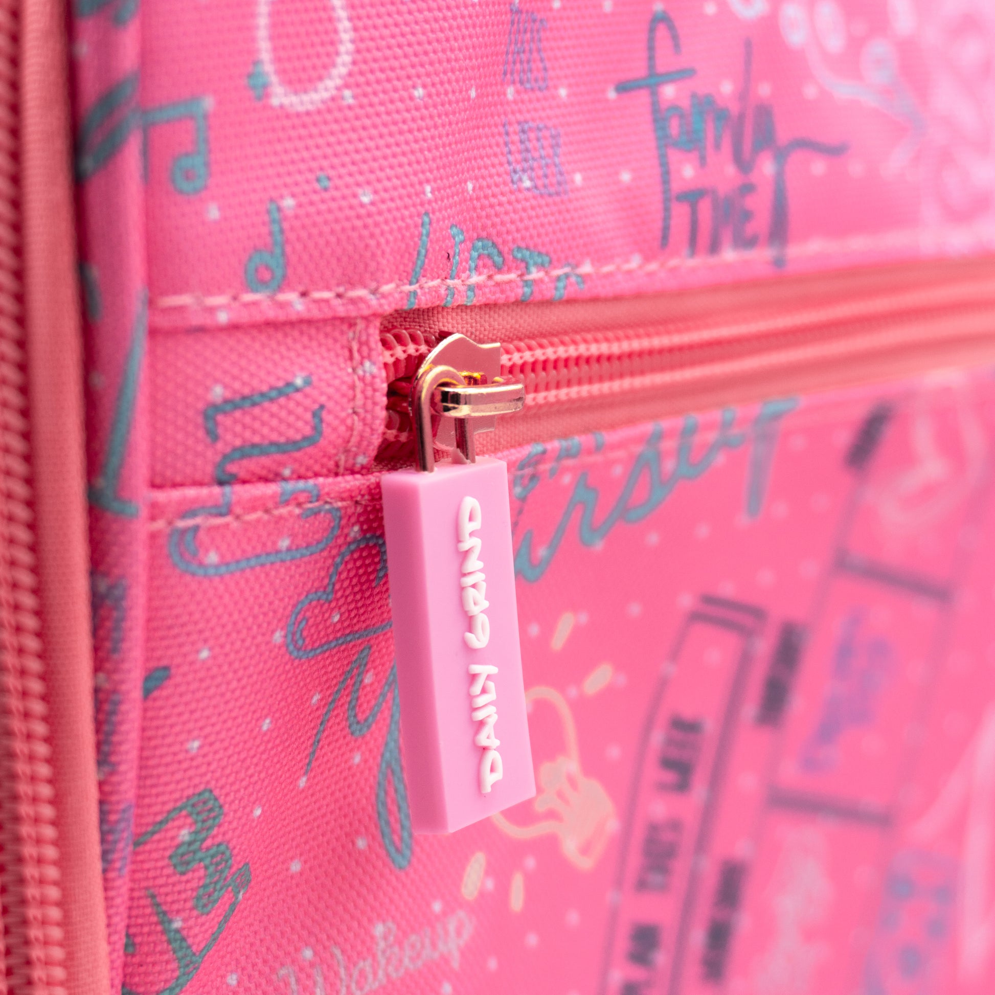 Close up of "Daily Grind" pink zipper detail