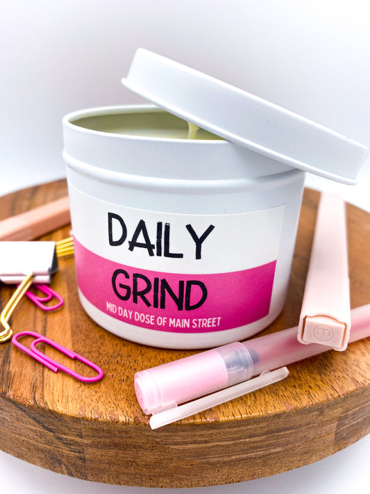 Unlit "Daily Grind" candle in white tin