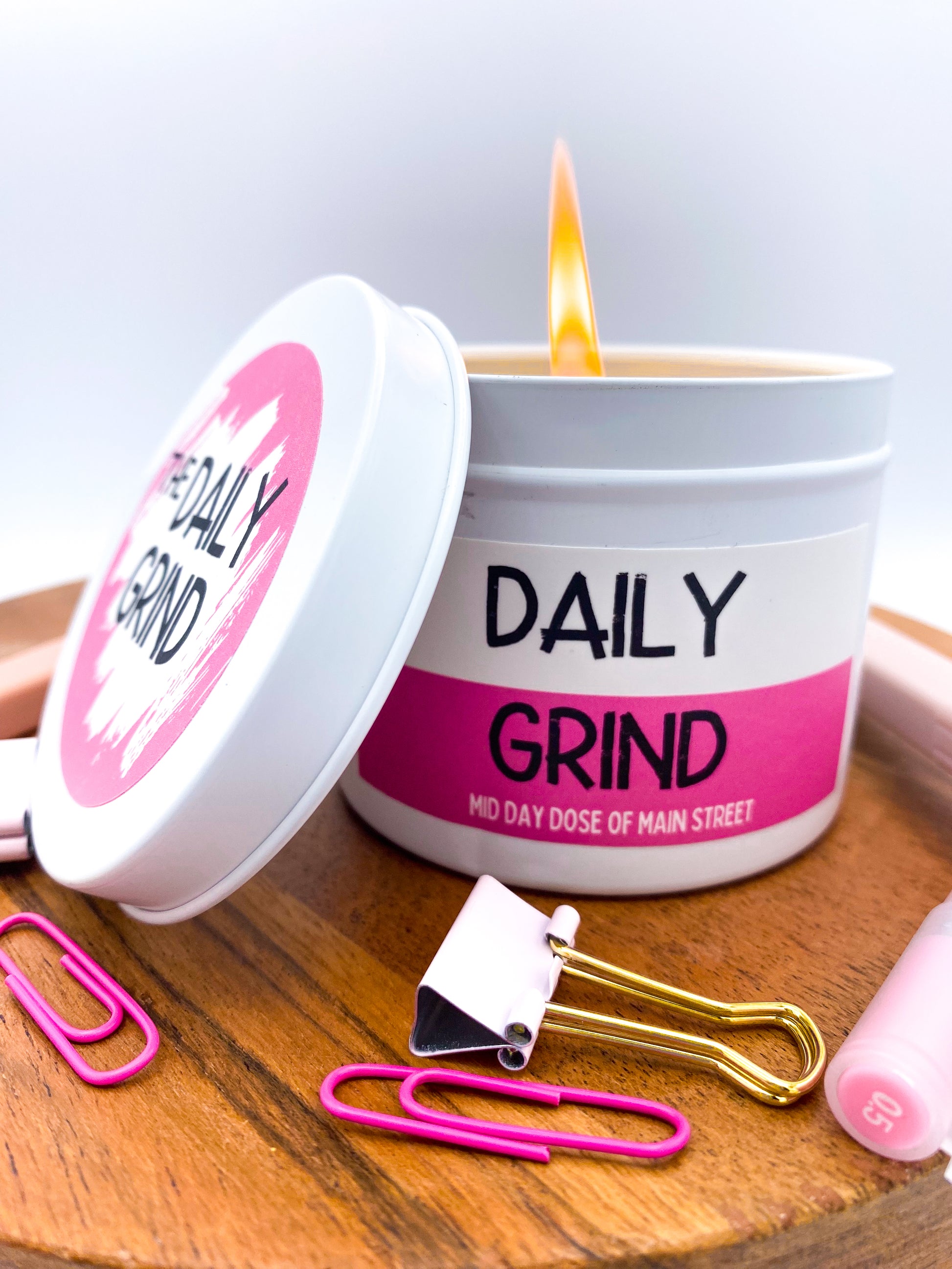 Lit "Daily Grind" candle in white tin