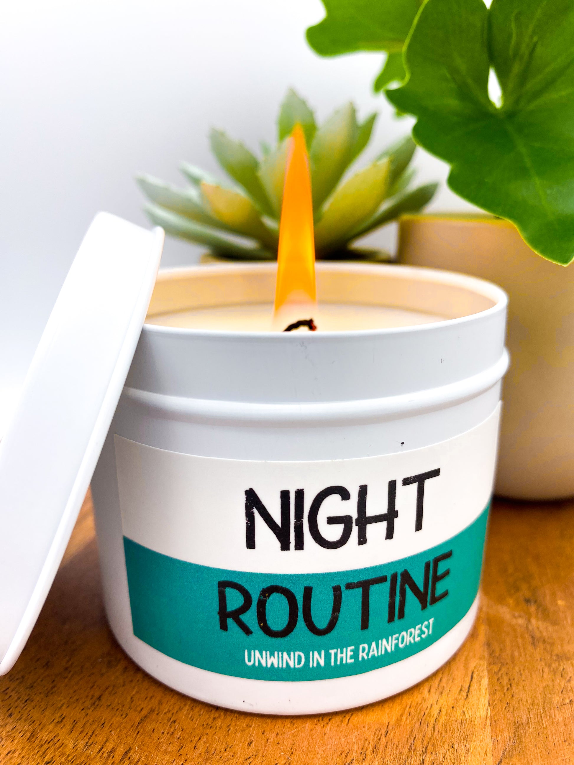 Lit "Night Routine" candle in white tin