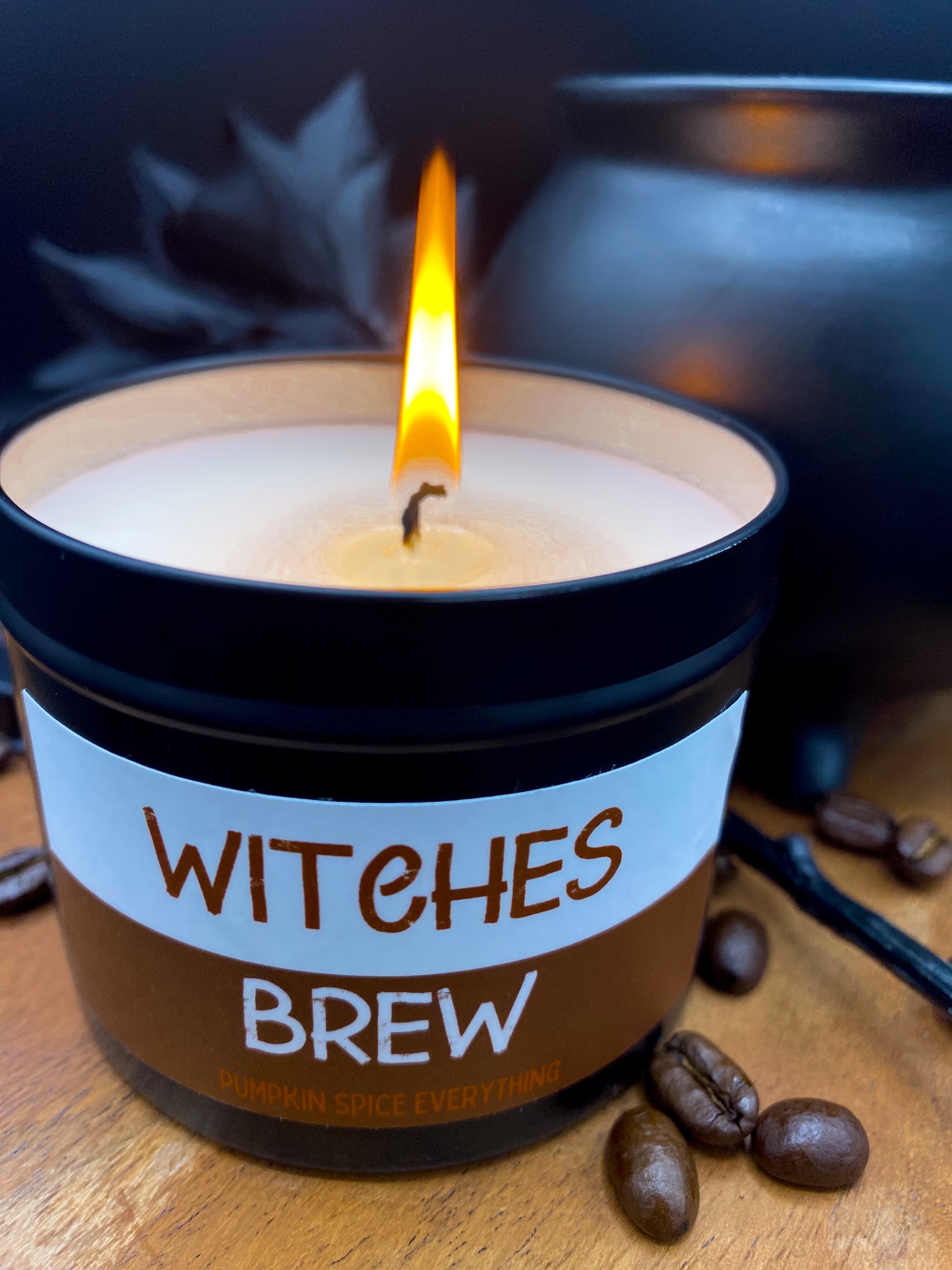 Lit "Witches Brew" candle in black tin