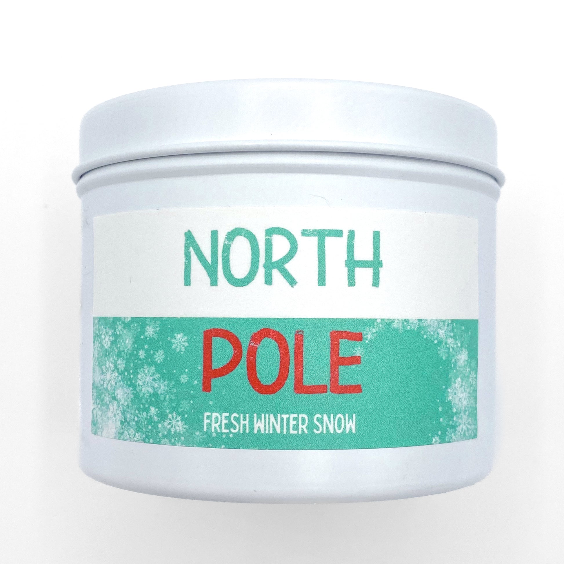 "North Pole" holiday candle in decorative white tin