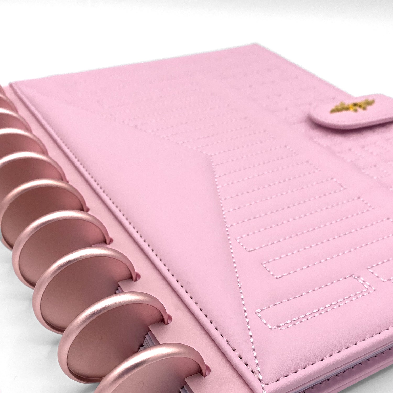 Pink faux leather planner with rose gold discs