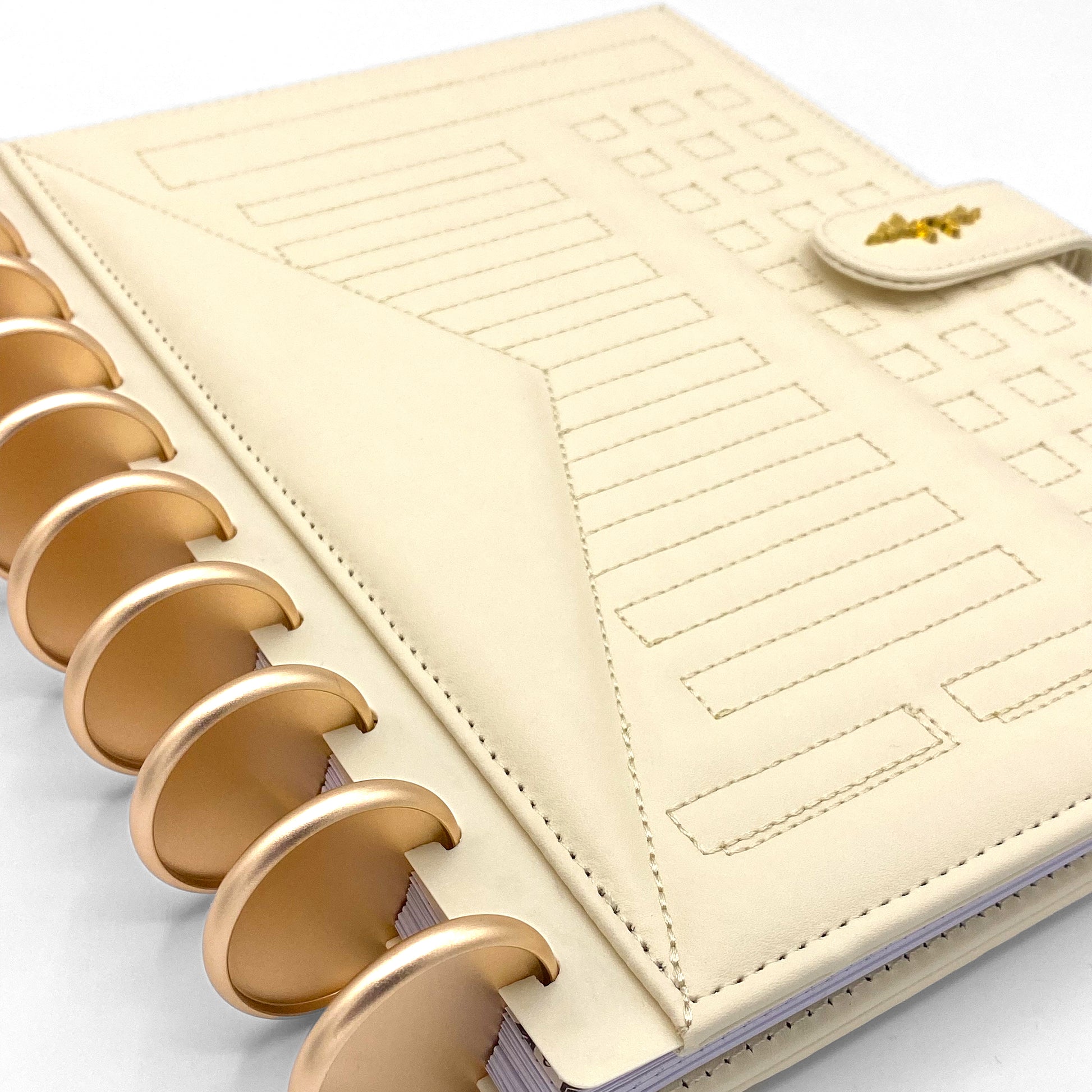 Cream faux leather planner with gold discs