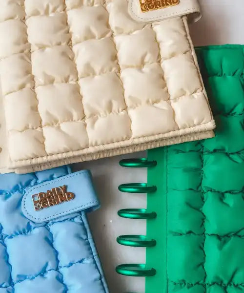 Quilted sleeves in beige, blue, and green with 'daily grind' branding.