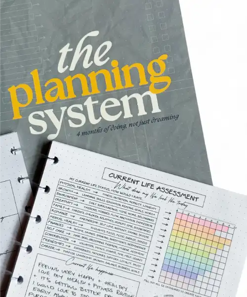 Planner with 'the planning system' cover and open pages showing assessment questions.