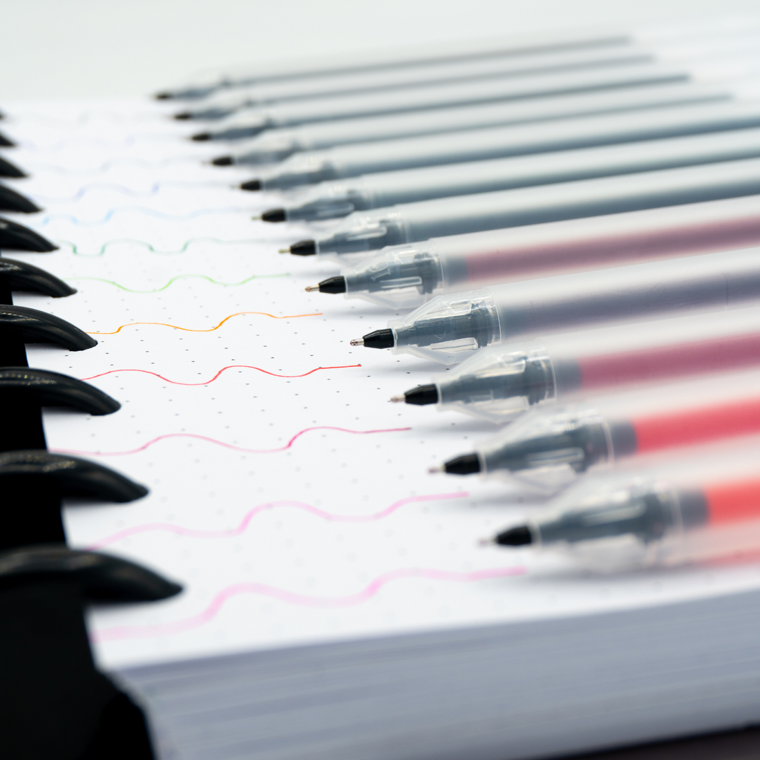 Close up of pens and their colors on paper